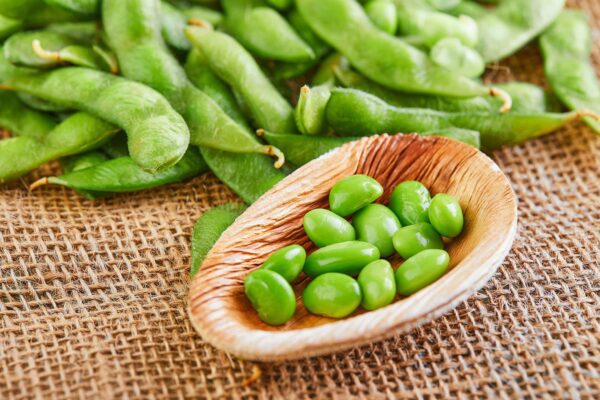 bigstock-edamame-or-soybeans-in-a-woode-375183415